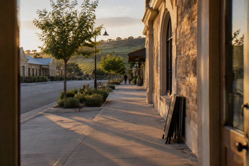A stone heritage building on the main street of Tanunda at golden hour